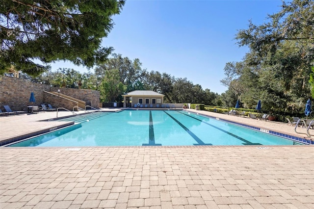 view of swimming pool with a patio area