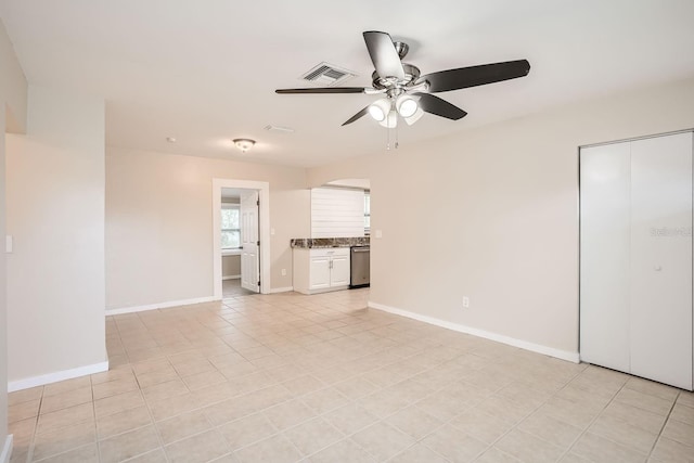 interior space with ceiling fan and light tile patterned flooring