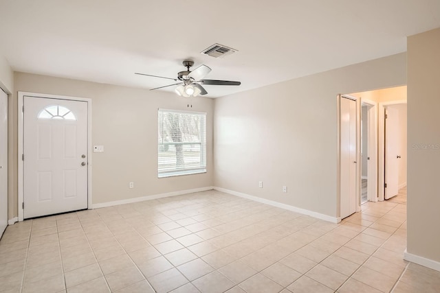 6445 Skyline Ct, Spring Hill, FL 34606 - entrance foyer featuring plenty of natural light, a ceiling fan, light tile patterned floors, and baseboards