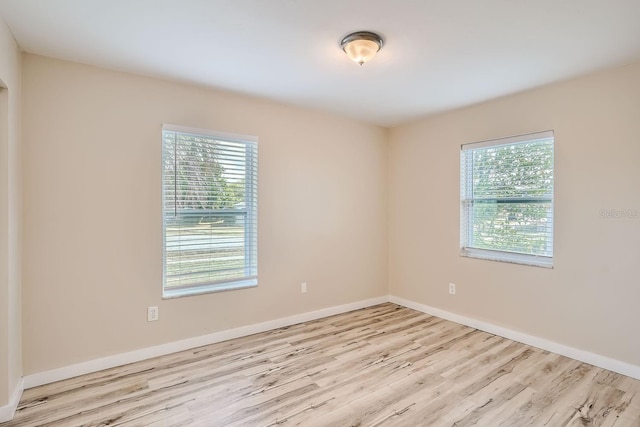 spare room with light hardwood / wood-style floors