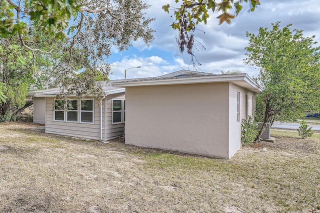 6445 Skyline Ct, Spring Hill, FL 34606 - view of property exterior with stucco siding