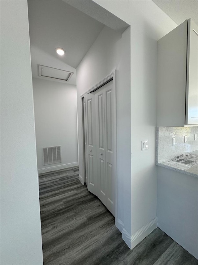 hallway featuring dark hardwood / wood-style flooring