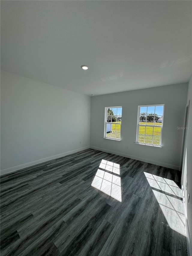 unfurnished room featuring dark hardwood / wood-style floors