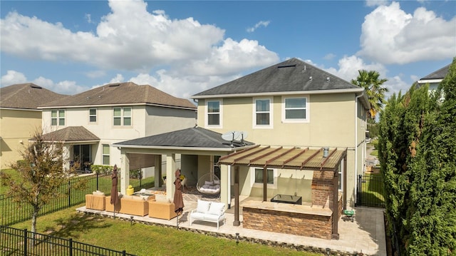 back of property featuring a patio area, an outdoor living space, a yard, and a pergola