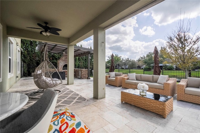 view of patio featuring a pergola, ceiling fan, and outdoor lounge area