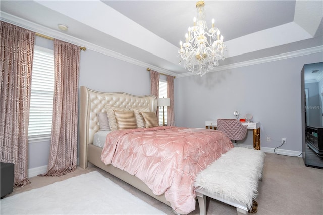 carpeted bedroom with ornamental molding, a chandelier, and a tray ceiling