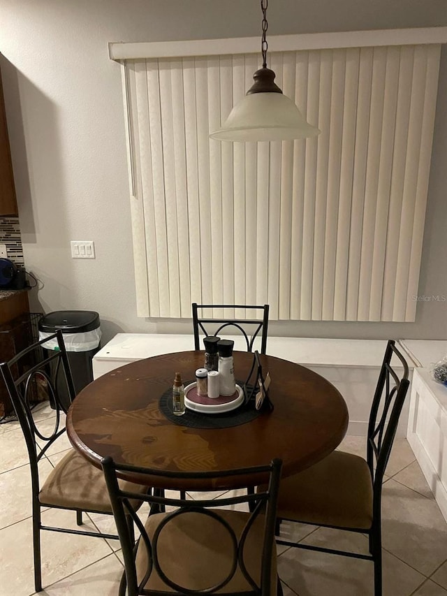 dining space with light tile patterned floors