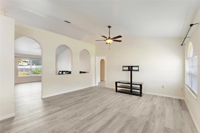 unfurnished living room with lofted ceiling, light hardwood / wood-style floors, and ceiling fan