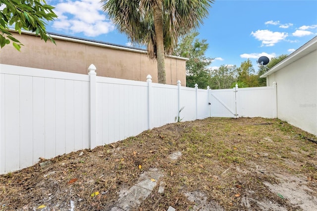 view of yard with a gate and fence