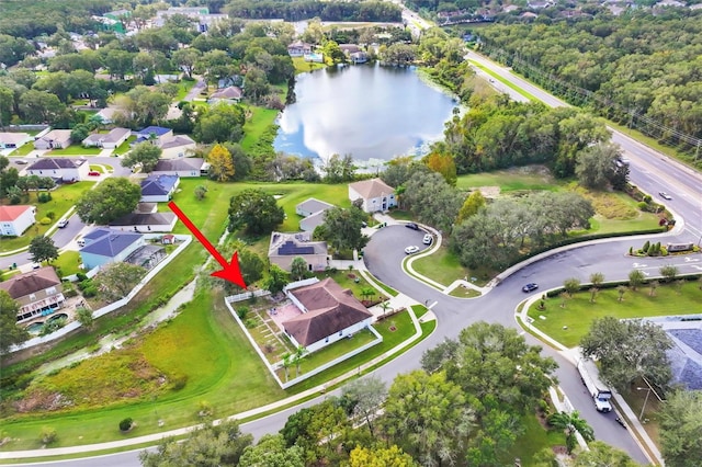 bird's eye view featuring a residential view and a water view