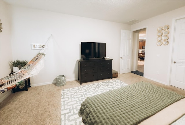 bedroom featuring light colored carpet