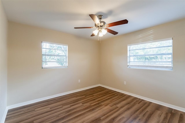 unfurnished room featuring ceiling fan and dark hardwood / wood-style floors