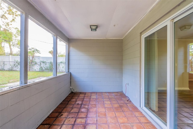 unfurnished sunroom with plenty of natural light