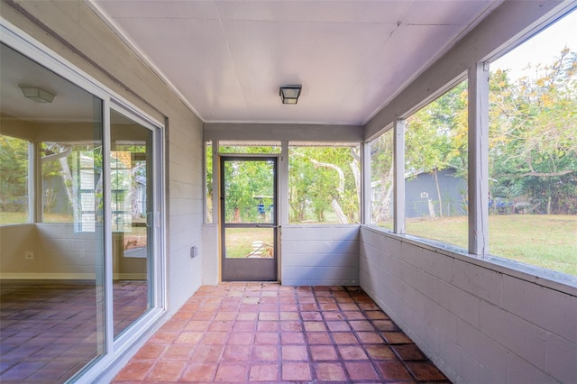 unfurnished sunroom with a wealth of natural light