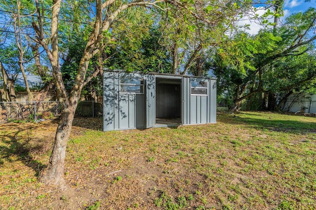 view of outbuilding featuring a yard