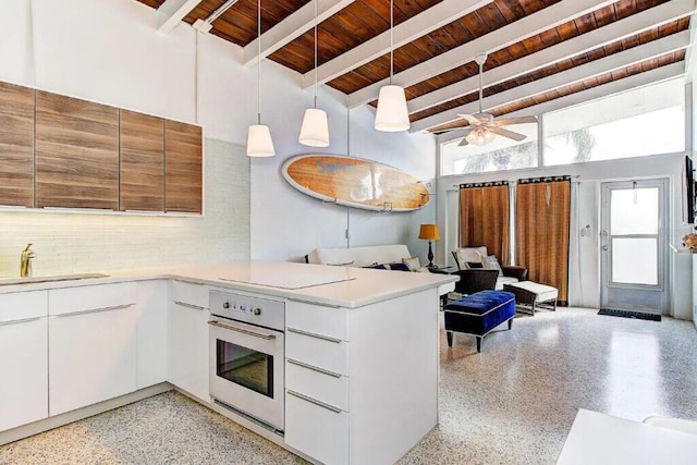 kitchen featuring white cabinets, stainless steel oven, wooden ceiling, sink, and decorative light fixtures