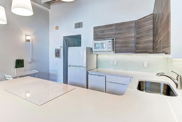 kitchen with white appliances and sink