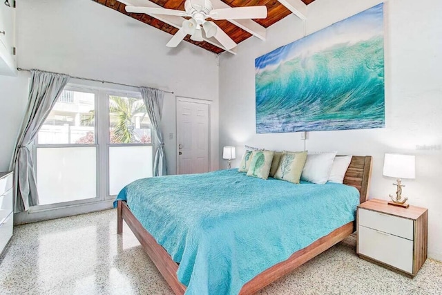 bedroom featuring light speckled floor, wood ceiling, beam ceiling, and ceiling fan