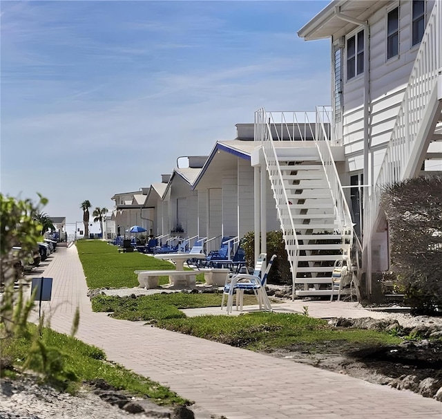 view of home's community featuring stairs