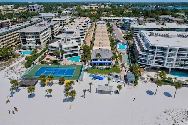 birds eye view of property with a city view and a water view