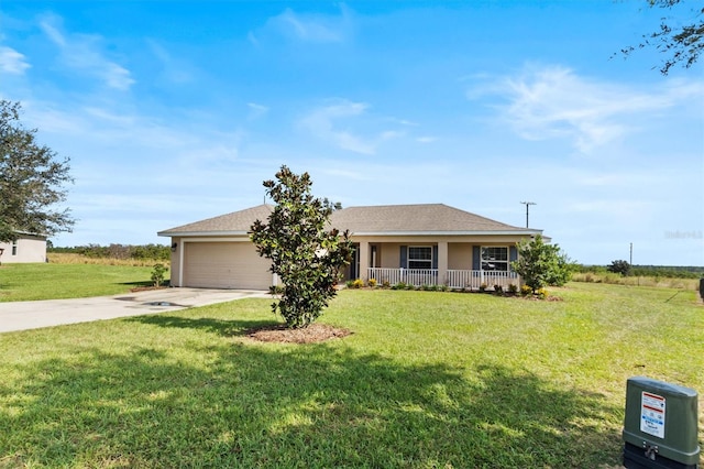 single story home with a front lawn, covered porch, and a garage