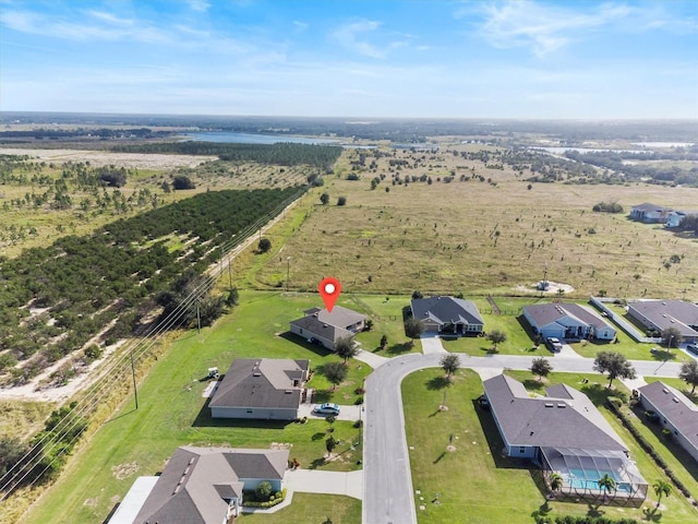 birds eye view of property with a rural view