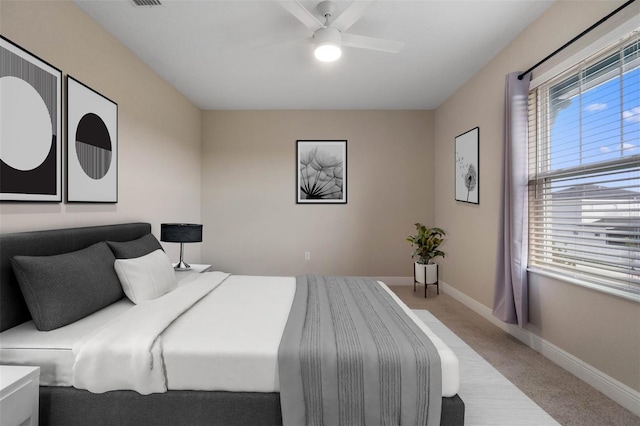 bedroom featuring carpet, baseboards, and ceiling fan