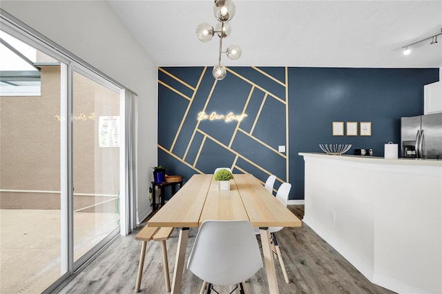 dining area with wood-type flooring