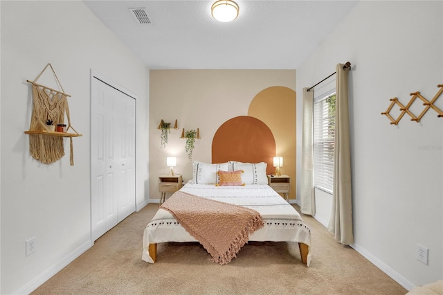 bedroom with carpet flooring and a closet