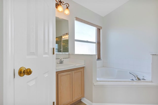 bathroom featuring vanity and a bathing tub