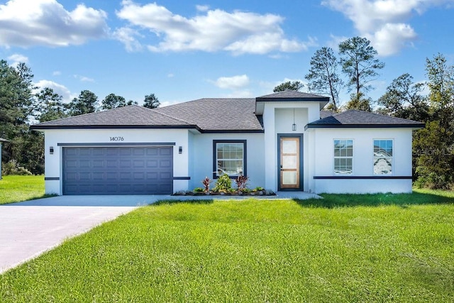 view of front facade featuring a front lawn and a garage