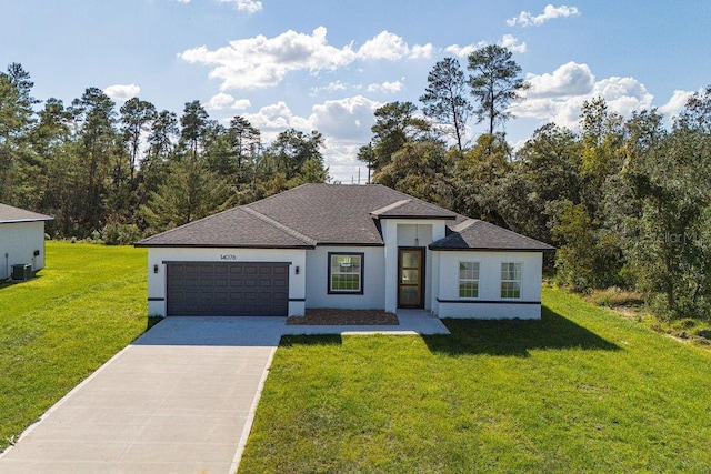 view of front facade with a garage, a front lawn, and central AC unit