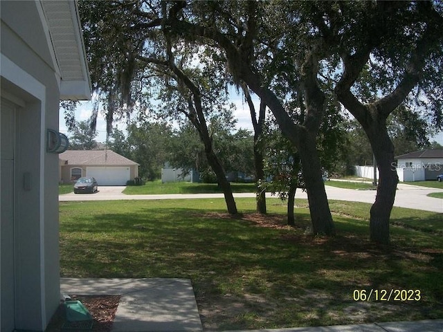 view of yard featuring a garage