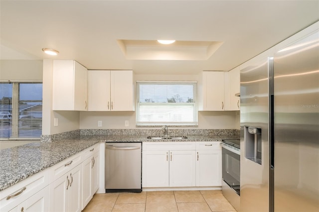 kitchen featuring white cabinetry, stainless steel appliances, and sink