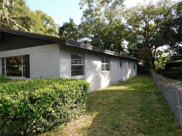 view of property exterior featuring a yard