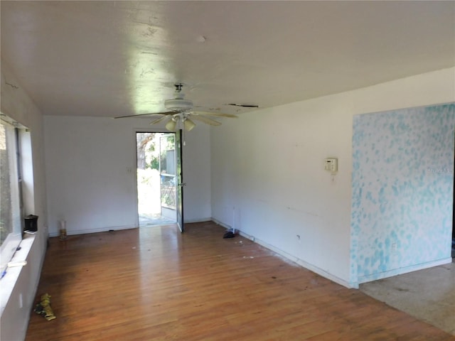 spare room featuring light hardwood / wood-style floors and ceiling fan