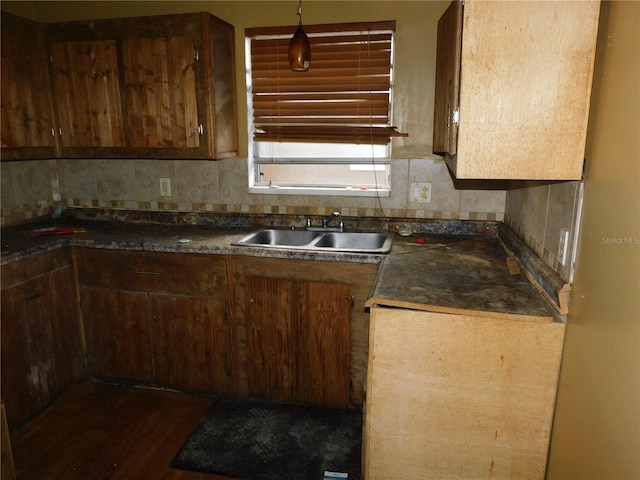 kitchen with sink, backsplash, and dark hardwood / wood-style flooring