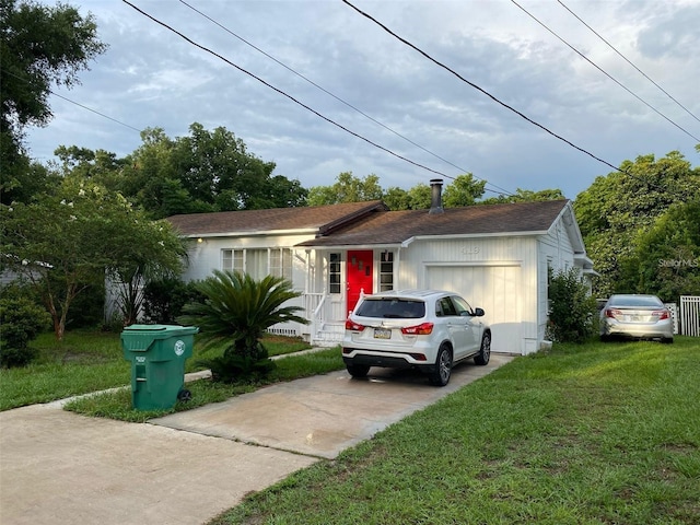 single story home with a front lawn and a garage