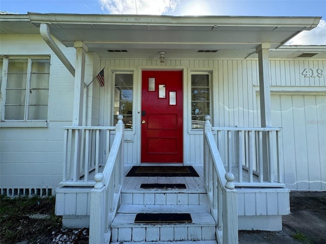 doorway to property with covered porch