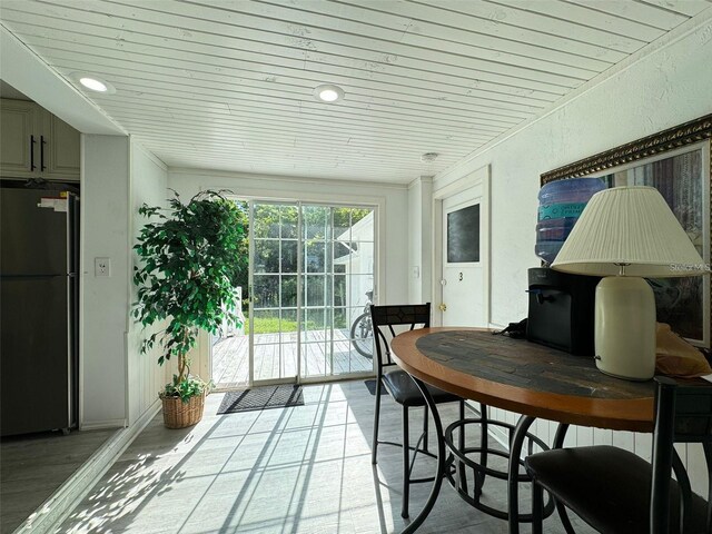 sunroom / solarium with wood ceiling