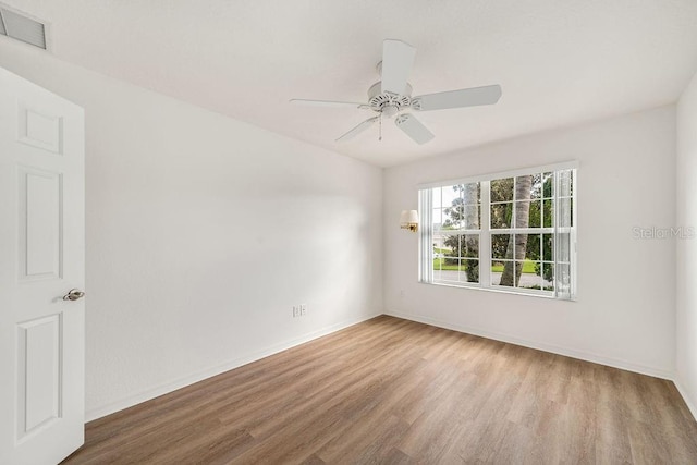 unfurnished room featuring light hardwood / wood-style flooring and ceiling fan