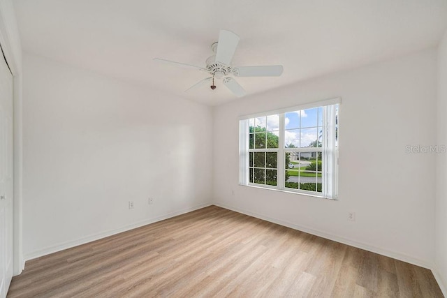 unfurnished room with light hardwood / wood-style floors and ceiling fan