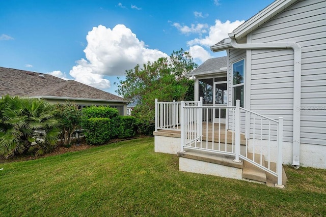 view of yard with a sunroom