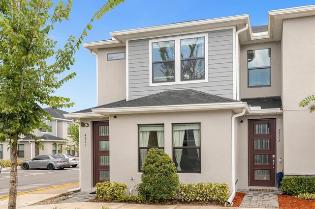 4715 Terra Esmeralda Dr, Kissimmee, FL 34746 - view of front of house with roof with shingles and stucco siding
