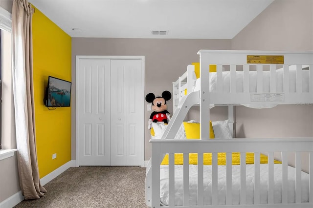 bedroom with a closet and carpet flooring