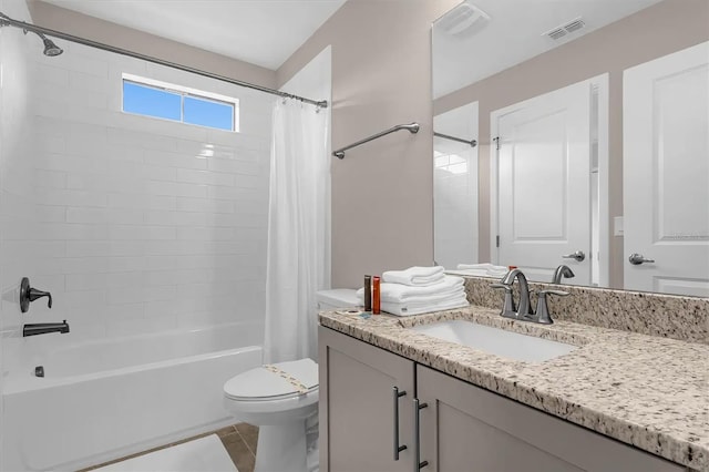 full bathroom with vanity, toilet, tile patterned flooring, and shower / tub combo with curtain