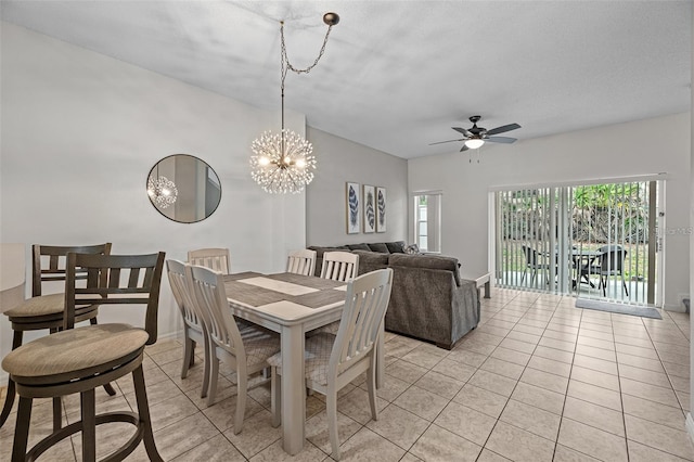 1029 Park Ridge Cir, Kissimmee, FL 34746 - dining room featuring light tile patterned floors, a ceiling fan, a chandelier, and baseboards
