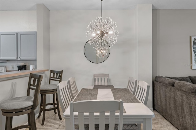 1029 Park Ridge Cir, Kissimmee, FL 34746 - dining area with a chandelier and light tile patterned floors