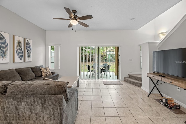 1029 Park Ridge Cir, Kissimmee, FL 34746 - living area with plenty of natural light, light tile patterned floors, stairs, and ceiling fan