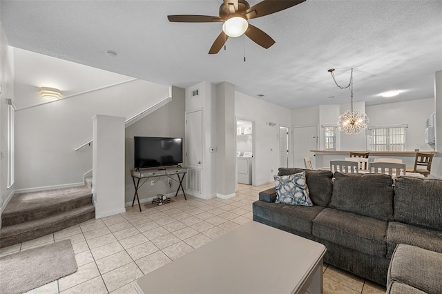 1029 Park Ridge Cir, Kissimmee, FL 34746 - living area featuring stairs, light tile patterned flooring, ceiling fan, a chandelier, and baseboards